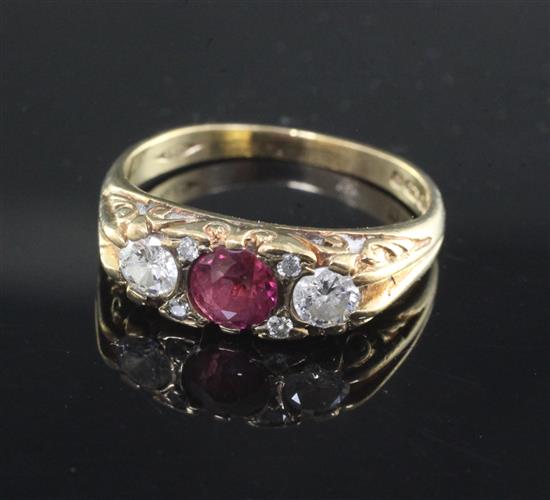 A 9ct gold, ruby and diamond three stone ring, size O.